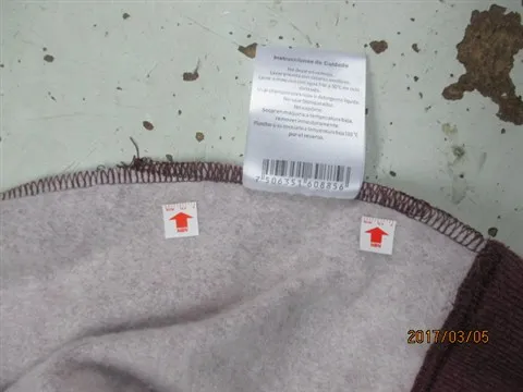 Double seam on Care Label CRI